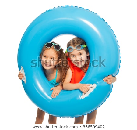 Stok fotoğraf: Little Girl On A Beach With A Rubber Ring