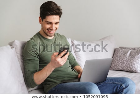 Foto stock: Relaxed Man With A Laptop And Phone