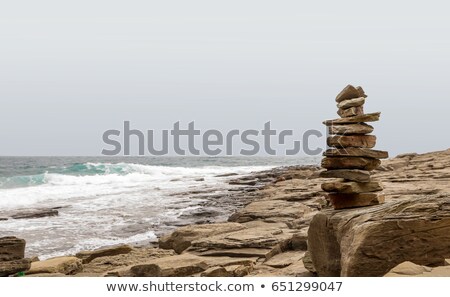 Stockfoto: Stone Figures On Beach Shore Of Illetes Beach In Formentera