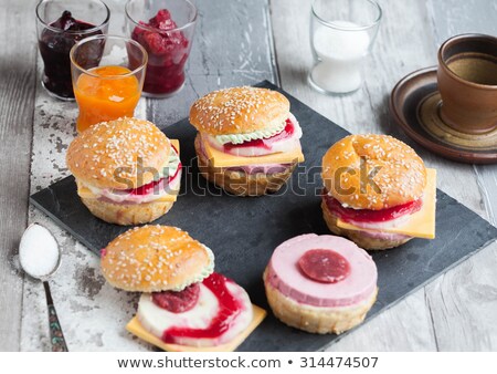 Foto d'archivio: Sesame Seeds With A Wooden Spoon On A Small Wooden Tray