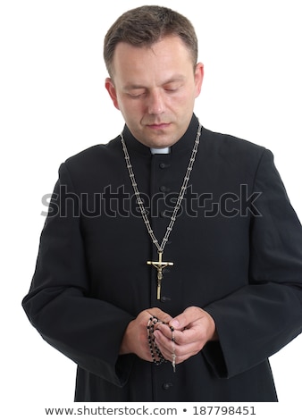Stock photo: Priest Says The Rosary