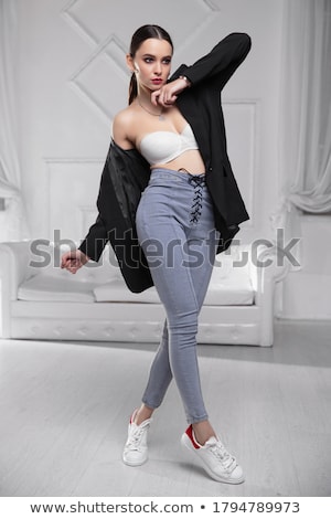 Foto stock: Model Poses Wearing Bra With Jeans