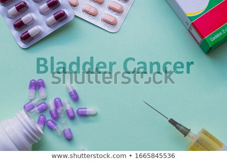 Foto d'archivio: Cancer Treatment - Printed Diagnosis On Green Background