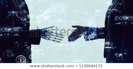 Foto stock: Hand Of A Businessman Shaking Hands With A Android Robot