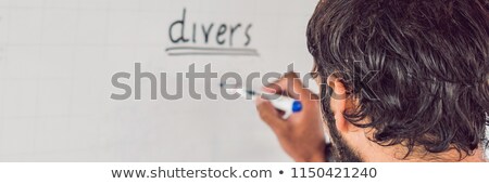 Foto d'archivio: Diver Writes A Marker On The Board Banner Long Format