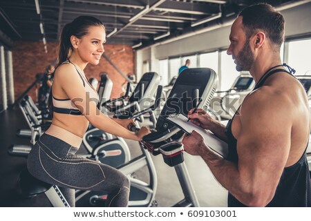 Сток-фото: Group Spinning With Personal Trainer In Gym
