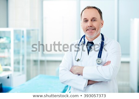 [[stock_photo]]: Old Male Doctor Working In The Clinic