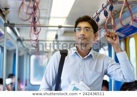 Stok fotoğraf: Man Riding Tram To Work