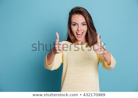 Stock photo: Girl With Thumbs Up Isolated On White Background