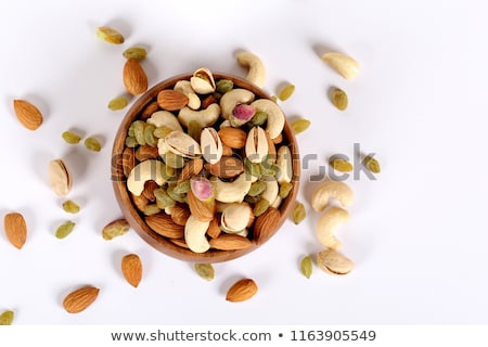Сток-фото: Healthy Food Hazelnuts Almonds Cashew Raisin And Dried Fruits On A Stone Black Background
