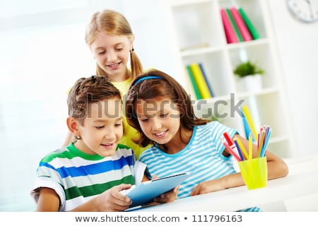 ストックフォト: Schoolkid Using Digital Tablet In Classroom