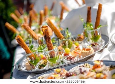 Stockfoto: Delicious Snacks On Wedding Reception Table In Luxury Outdoor Restaurant