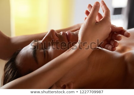 Foto d'archivio: Attractive Woman Receiving Facial Massage At Spa Center