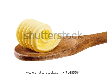 Stok fotoğraf: Butter Curl On A Wooden Spoon