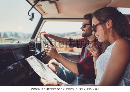 Zdjęcia stock: Side View Of A Happy Woman On Vacation With Map