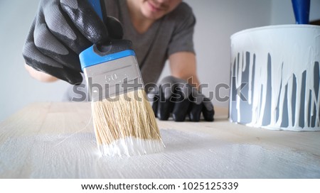 Stock photo: Painter Decorator Holding Brush And Can