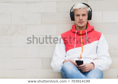 Zdjęcia stock: Attractive Young Fashion Man Sitting In The Park