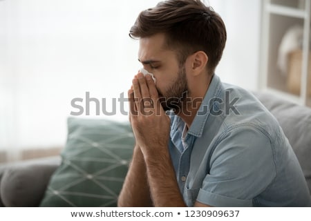 Сток-фото: Young Man Relaxing At Home On The Sofa Feel Depress