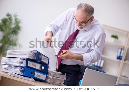 Stock photo: Aged Male Employee Unhappy With Excessive Work