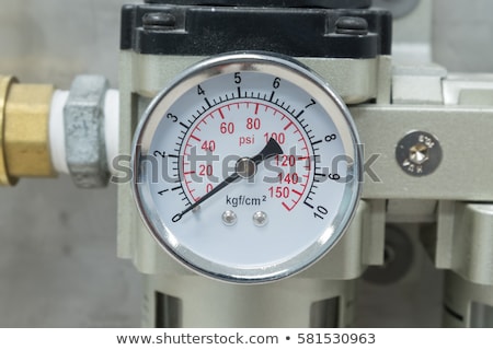 Stockfoto: Old Black Pipeline And Pressure Gauge