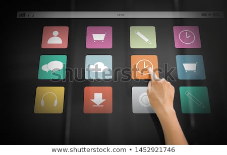 Foto d'archivio: Hand Using Interactive Panel With Network Icons