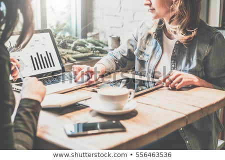 Stockfoto: Two Young Entrepreneurs Working At Coffee Shop