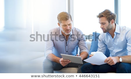 Foto stock: Two Businessmen In Conversation