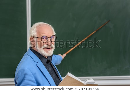 Stockfoto: Grey Haired Teacher Pointing