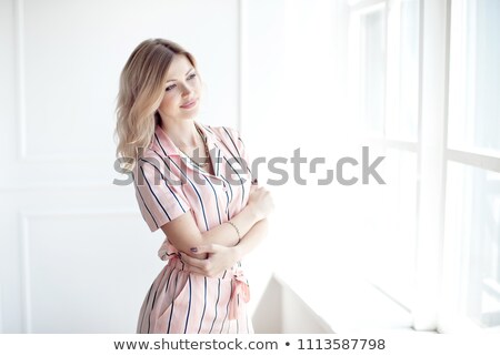 Stok fotoğraf: Happy Beautiful Woman Staring Out The Window
