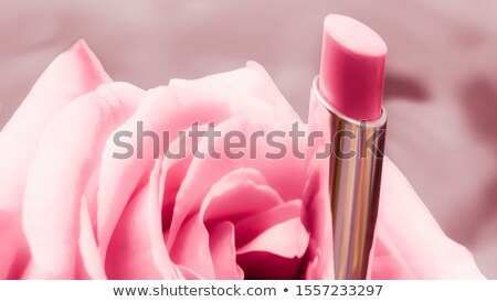 Сток-фото: Pink Lipstick And Rose Flower On Liquid Background Waterproof G