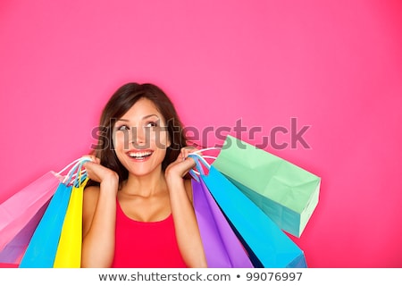 Shopping Woman Holding Shopping Bags Looking Up To The Side On W Stok fotoğraf © Ariwasabi