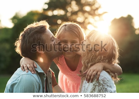Stock fotó: Cute Little Girls With Their Mom Outdoors