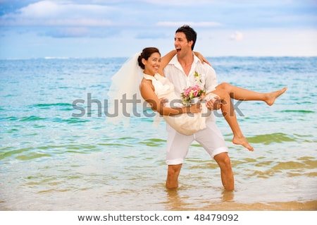 Сток-фото: Attractive Bride And Groom Getting Married By The Beach