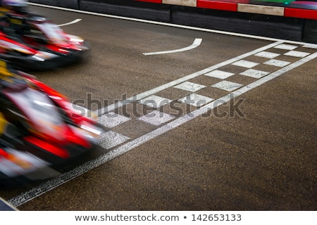 Stockfoto: Race Car Crossing The Finish Line