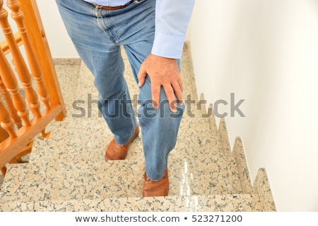 Stock fotó: Crop Man Touching Aching Knee