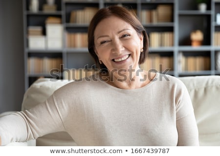 Foto stock: Cheerful Senior Woman At Home