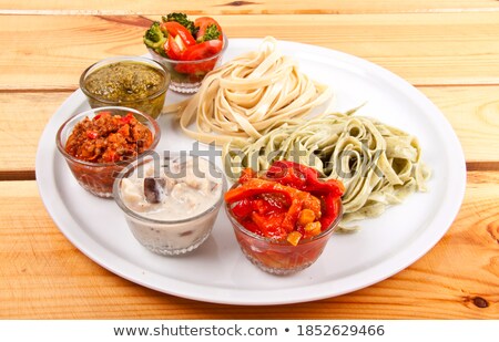 Foto stock: Two Italian Tagliatelles And Five Various Condiments