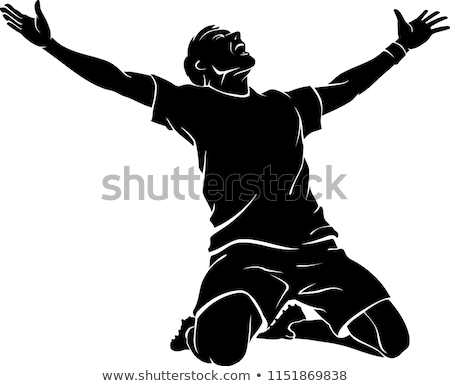 Foto stock: Happy Soccer Player Is Celebrating In Dark