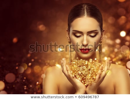 [[stock_photo]]: Beautiful Fashion Woman In Gold Elegant Brunette With Makeup L