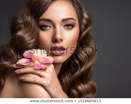 商業照片: Closeup On Beautiful Face With Flowers