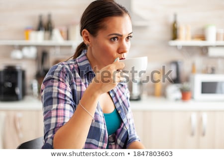 ストックフォト: Pretty Lady Smile And Pouring Tea From Teapot