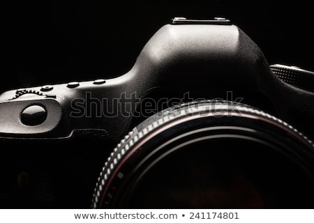 Foto d'archivio: Professional Modern Dslr Camera Low Key Image