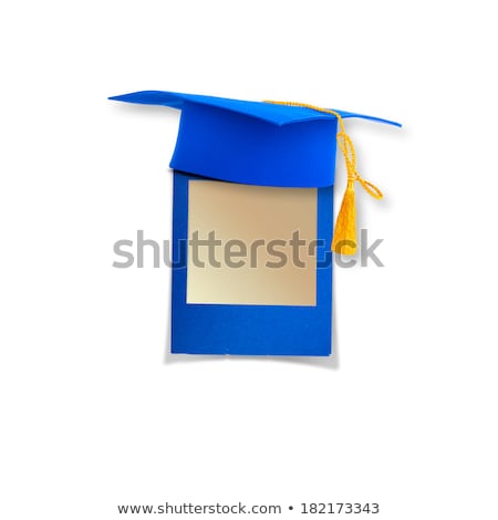 Foto d'archivio: Mortar Board Or Graduation Cap With Blue Slide On The Background