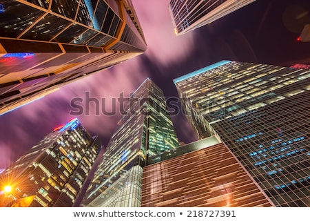 Stok fotoğraf: Skysrapers In Singapore During Night Hours