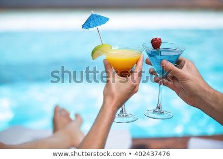 Zdjęcia stock: Woman Drinking Cocktail In Swimming Pool