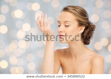 Сток-фото: Woman Smelling Perfume From Wrist Of Her Hand