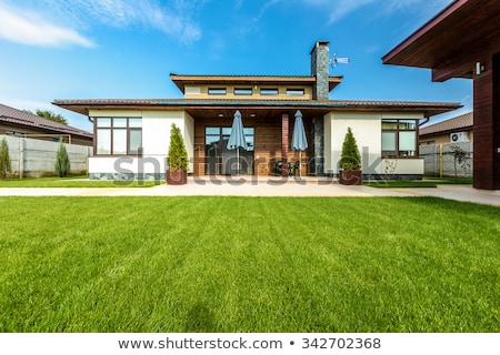 Stok fotoğraf: A Beautiful Garden In Front A Villa