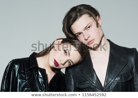 Foto d'archivio: Couple In Leather Clothes Posing In Studio