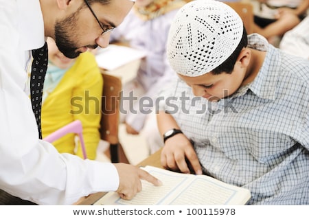 Stok fotoğraf: Arabic Middle Eastern Students At School Reading Koran