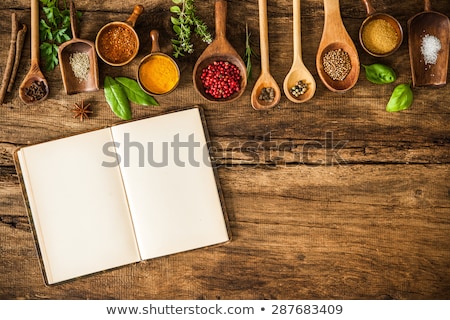 Stok fotoğraf: Culinary Background And Recipe Book With Various Spices On Wooden Table